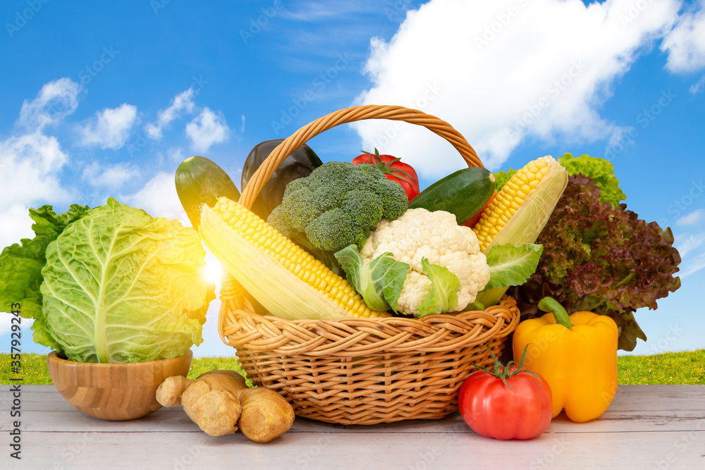 Group Healthy assorted fresh vegetable in a wooden basket, With vitamins c from salad, tomato, carro