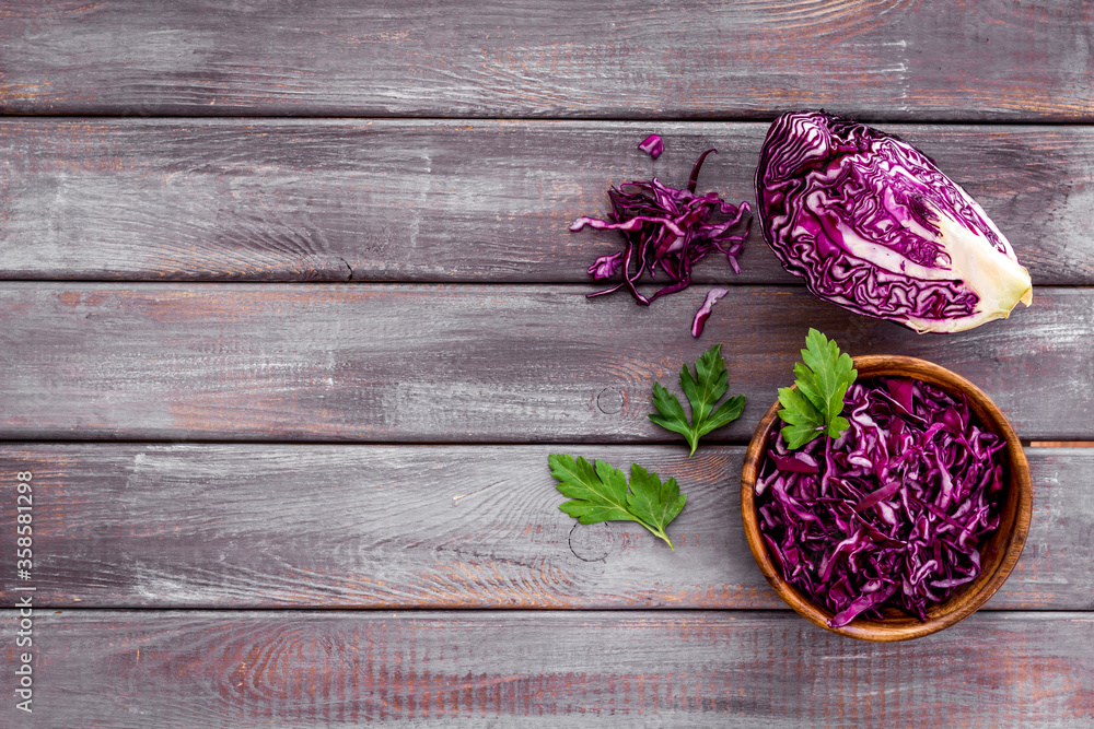 Red cabbage - coleslaw, cold-slaw - on wooden kitchen desk top-down copy space