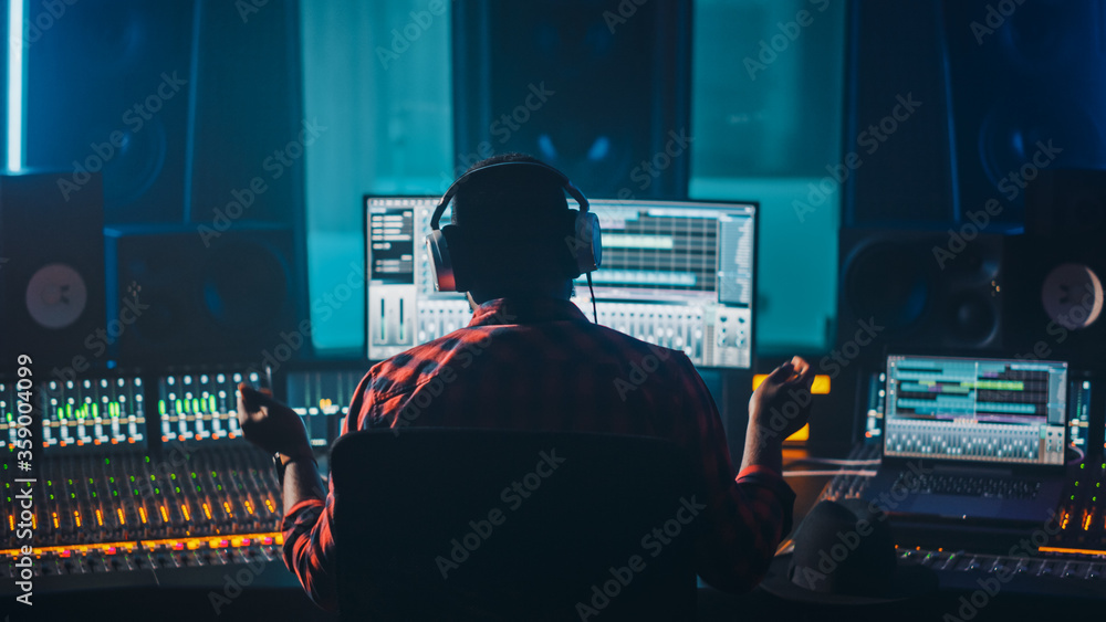Artist, Musician, Audio Engineer, Producer in Music Record Studio, Uses Control Desk with Computer S