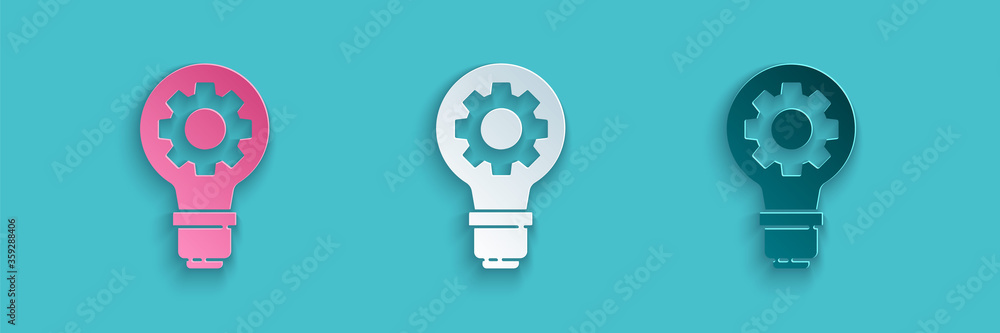蓝色背景上的剪纸灯泡和齿轮图标。创新理念。商业理念。P