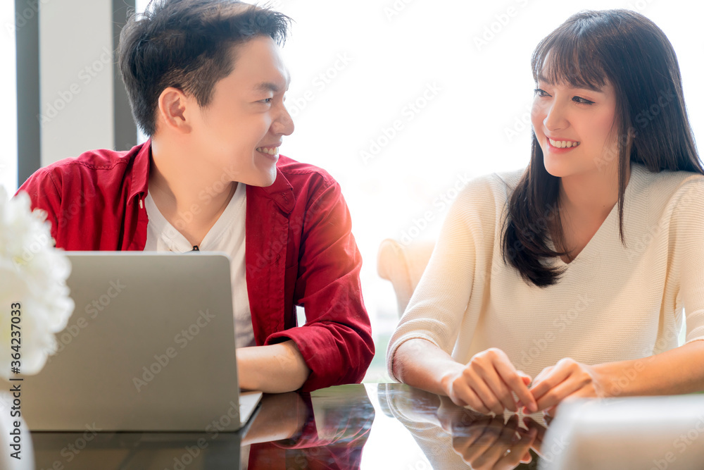 Happiness asian couple laugh smile together with in kitchen pantry humor emotional casual relax with