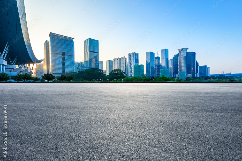 Empty racing track road and modern city buildings in Shenzhen,China.