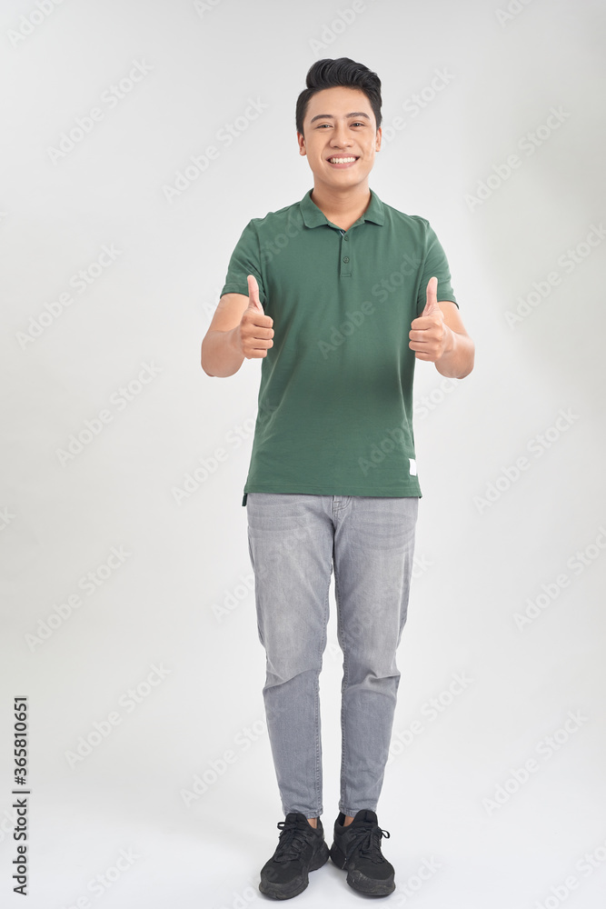 Happy handsome man showing thumbs up