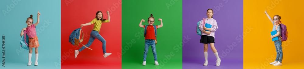 Kids with backpacks on colorful background