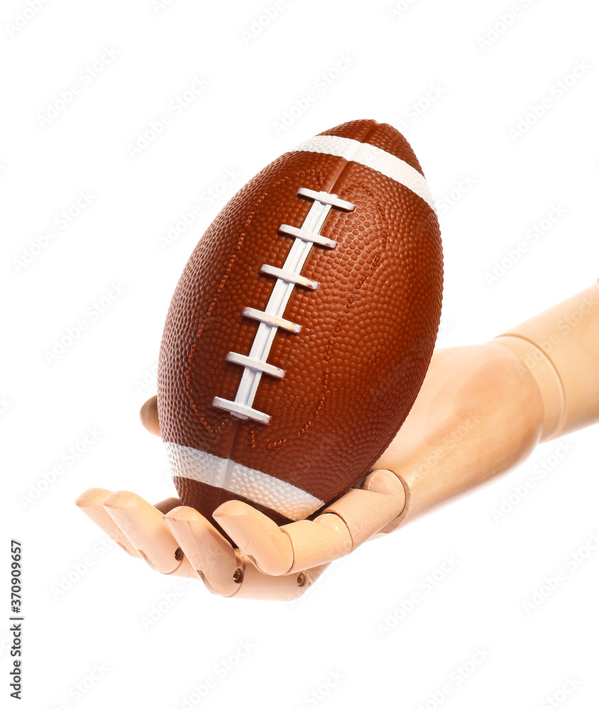 Hand of mannequin with rugby ball on white background