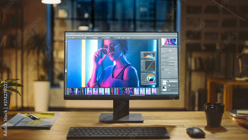 Shot of a Desktop Computer in the Modern Office with Monitor Showing Photo Editing Software. In the 