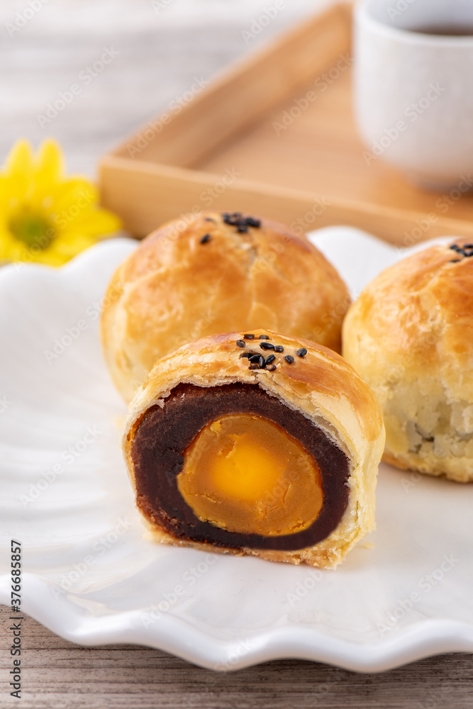 Moon cake yolk pastry, mooncake for Mid-Autumn Festival holiday, top view design concept on bright w