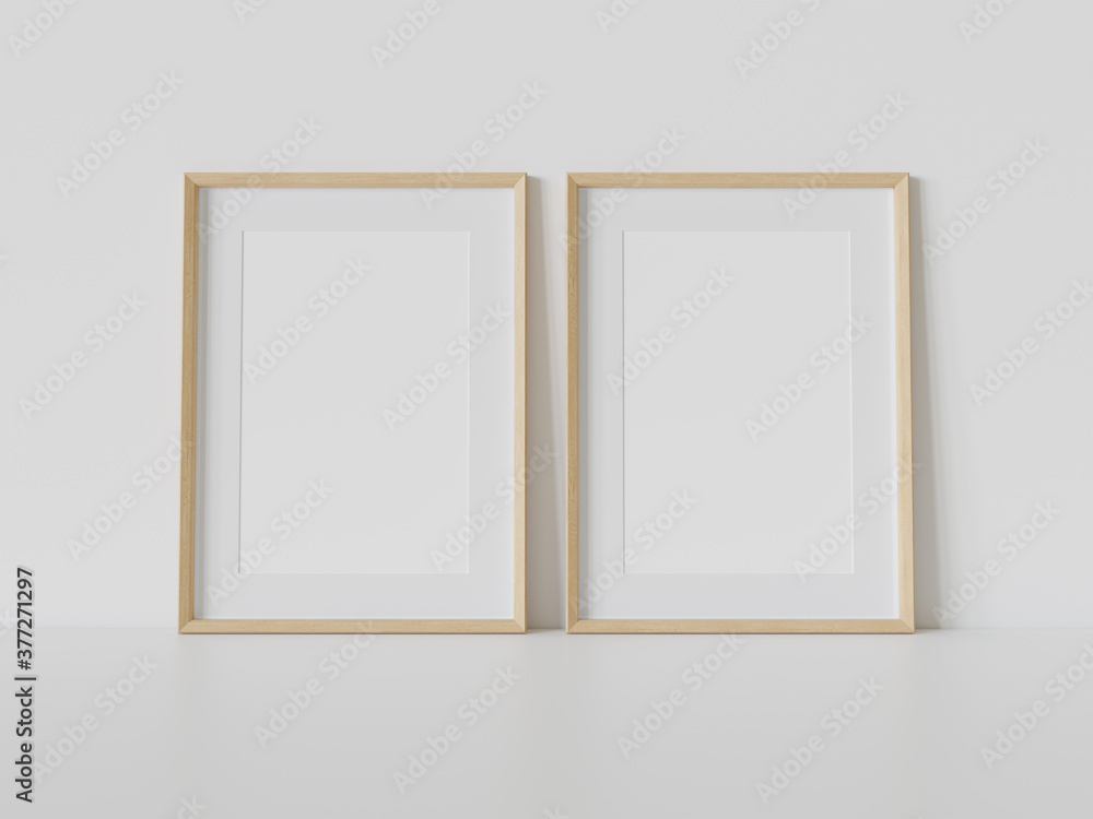室内模型中白色地板上的两个木框架。墙上的图片模板3