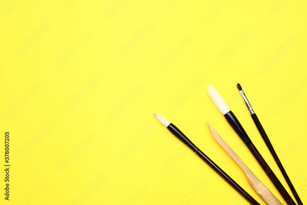 Brushes with pen on color background