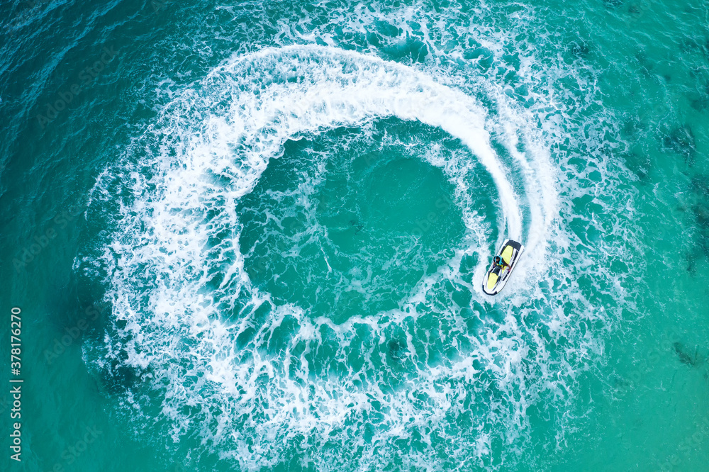 People are playing a jet ski in the sea.Aerial view. Top view.amazing nature background. The color o