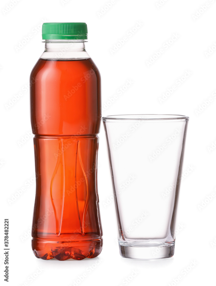 Bottle of fresh ice tea and glass on white background