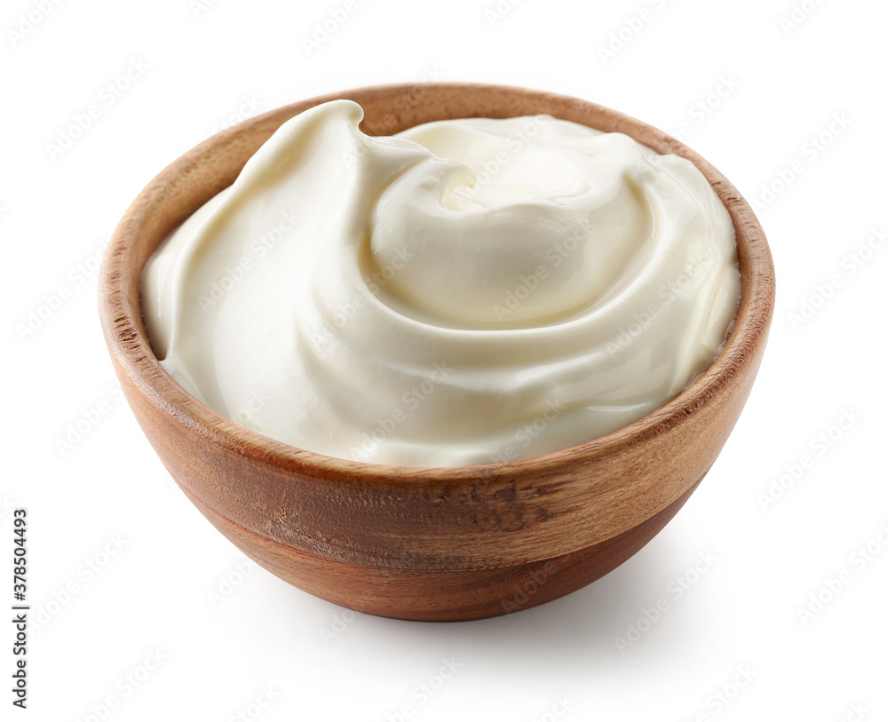 sour cream yogurt in wooden bowl