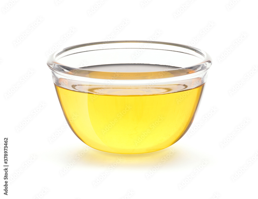 Vegetable Cooking Oil in glass bowl isolated on white background with clipping path