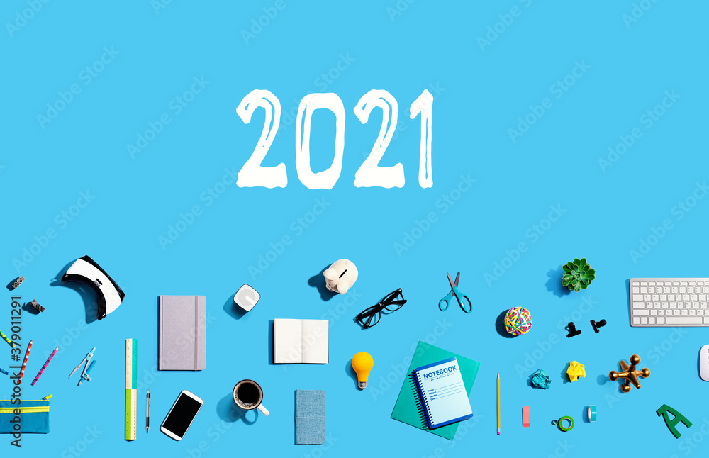 2021 new year concept with collection of electronic gadgets and office supplies