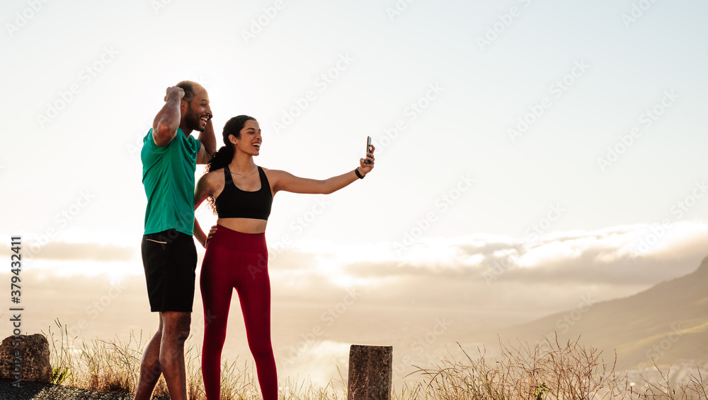 Running couple taking selfie