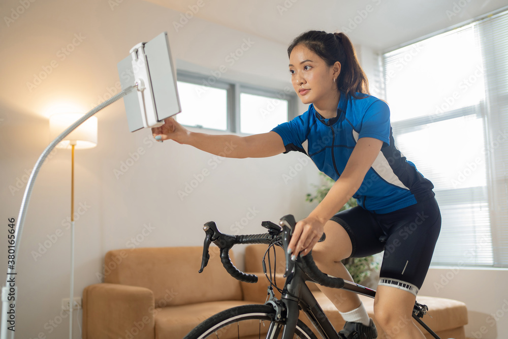 Asian woman Design a cycling training She is cycling indoors