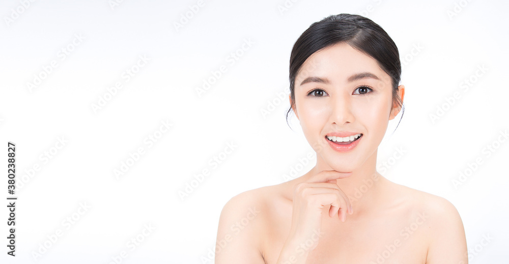 Closeup portrait of smile beauty asian woman with fair perfect healthy glow skin hand touch chin cop