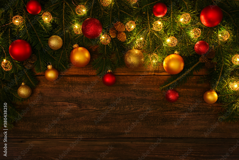Christmas tree with lights and balls over wood
