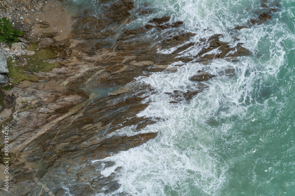 Aerial view of crashing waves on rocks landscape nature view and Beautiful tropical sea with Sea coa