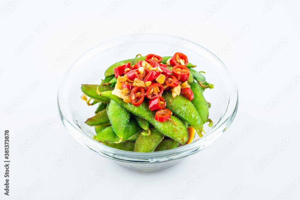 A plate of delicious cold edamame on white background