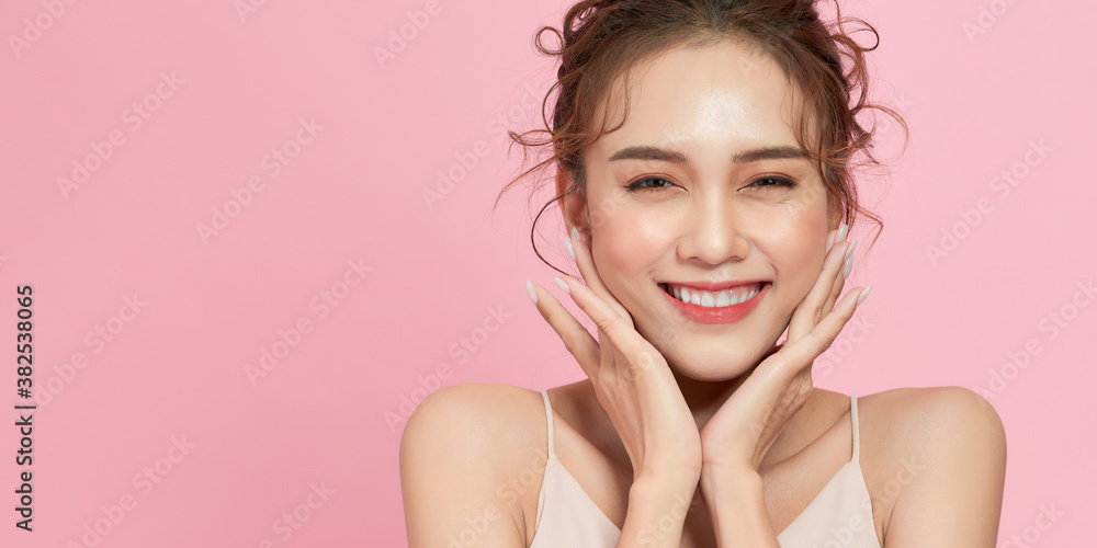 woman smile and wear dress with pink background
