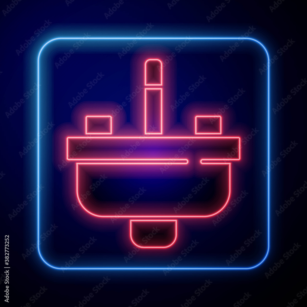Glowing neon Washbasin with water tap icon isolated on blue background. Vector.