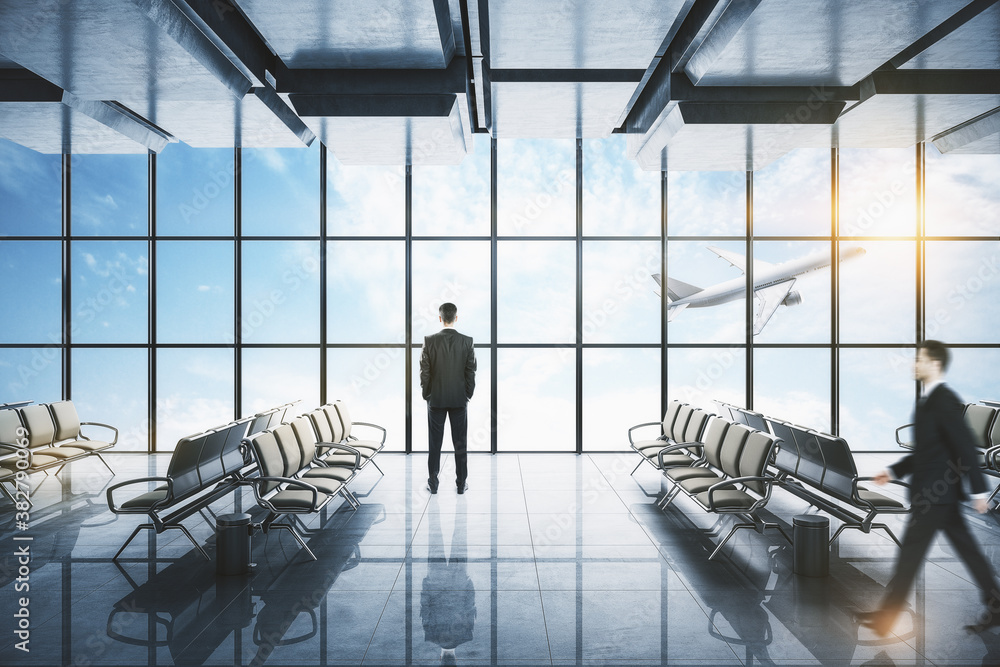 Businesspeople standing in airport interior