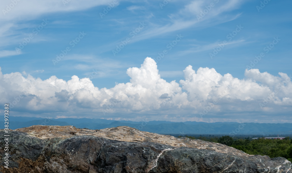 Stone podium on nature background with clouds and copy space use show product