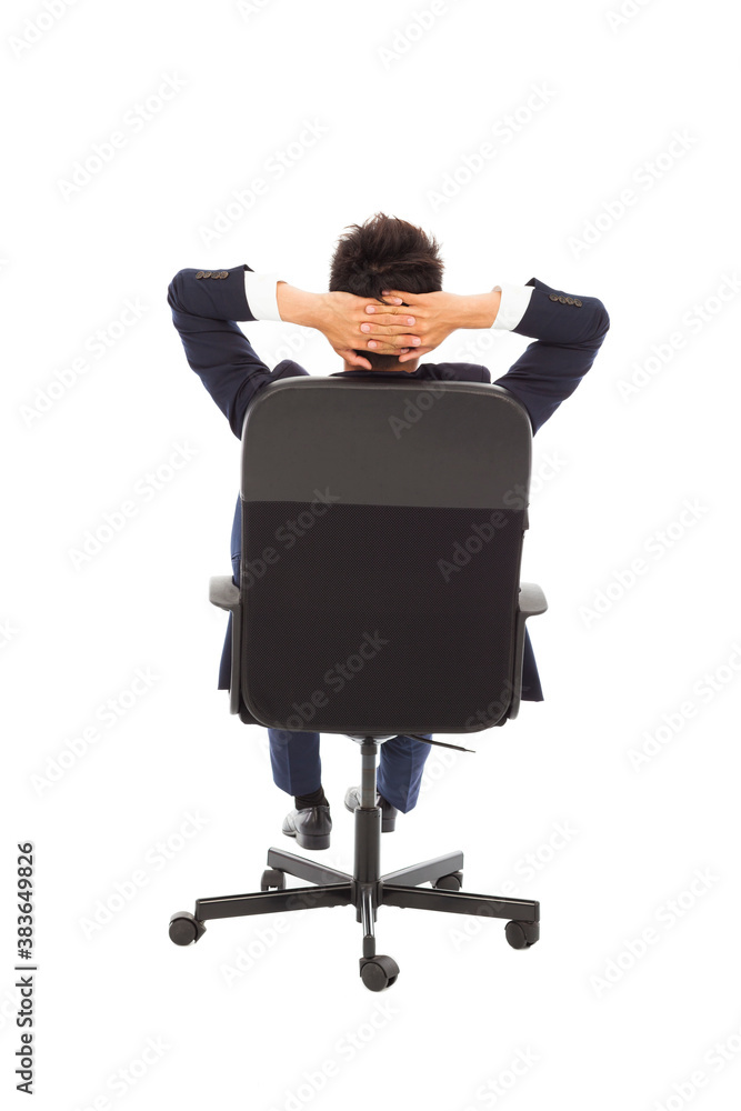 relaxing successful businessman leaning back