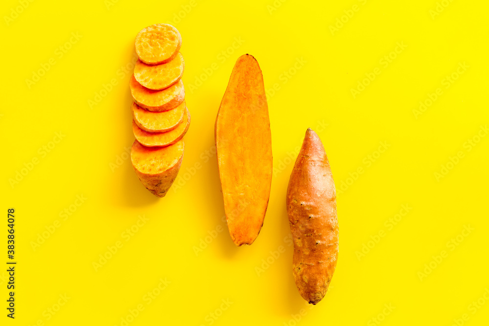 Set of whole and sliced sweet potatoes. Flat lay, top view