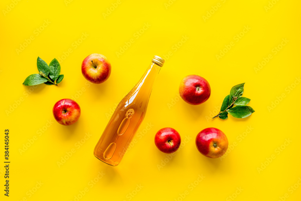 Apple cider vinegar in bottle with fruits top view