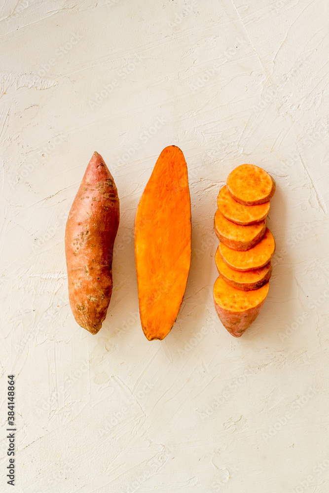 Pattern with sweet potato - yams. Organic vegetables background, overhead view