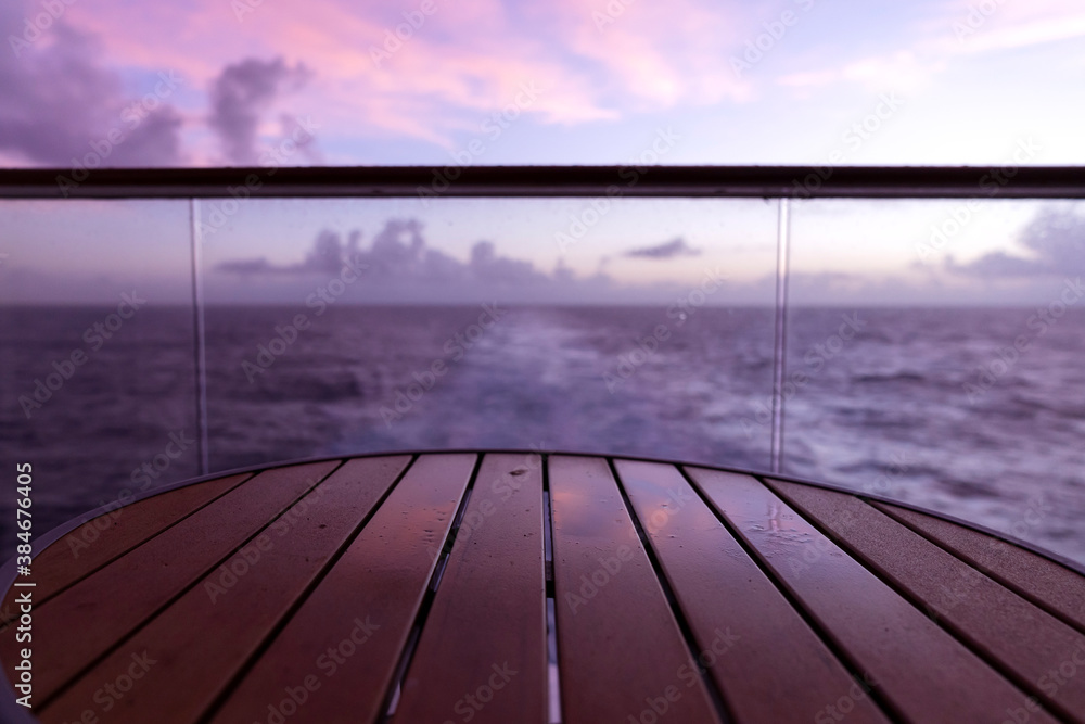 golden twilight senset on wooden curise deck vacation summer time