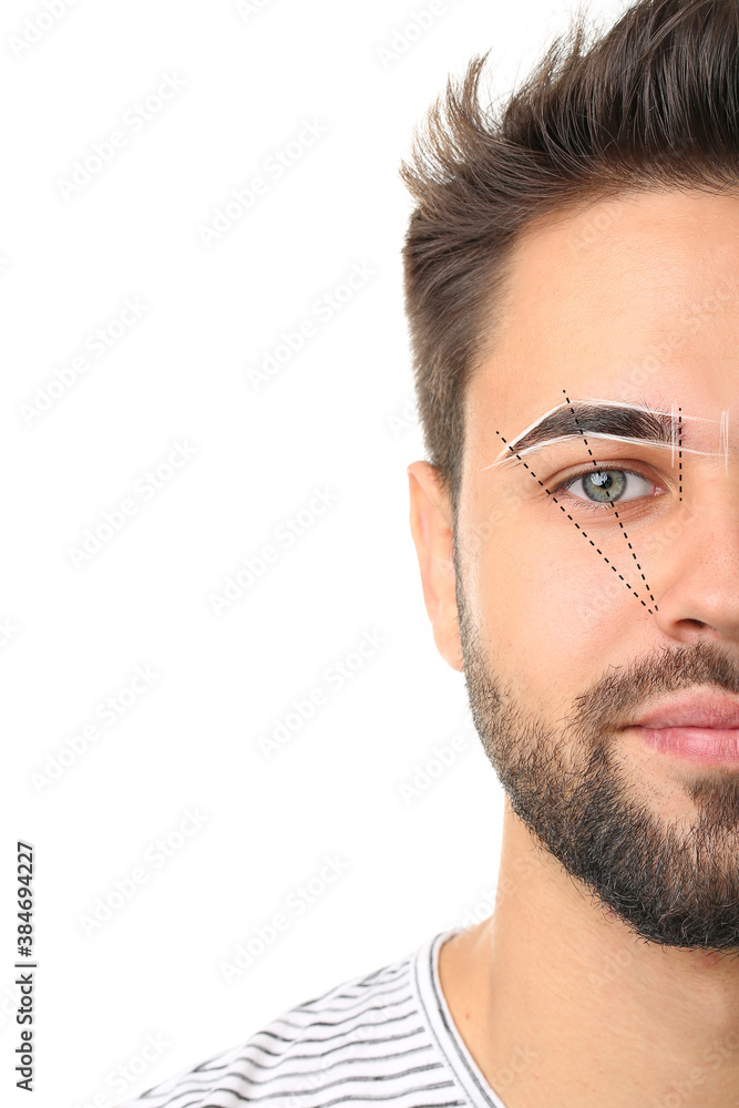 Young man with marking for eyebrow correction on white background