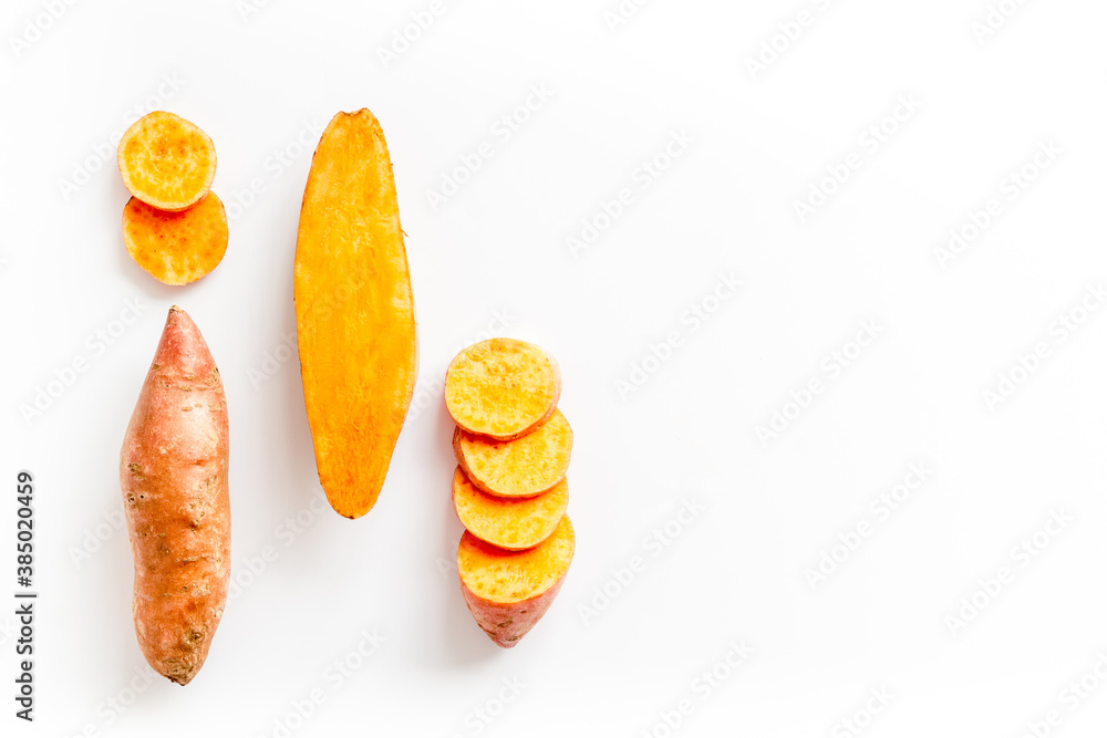 Sliced sweet potato on kitchet table, top view