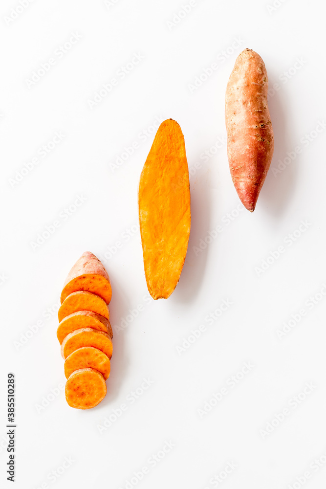 Pattern with sweet potato - yams. Organic vegetables background, overhead view