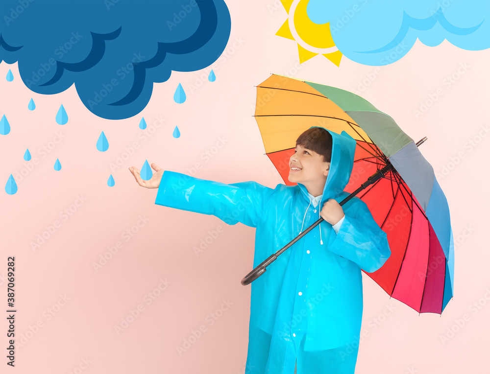 Cute little boy in raincoat and with umbrella on color background with drawn clouds