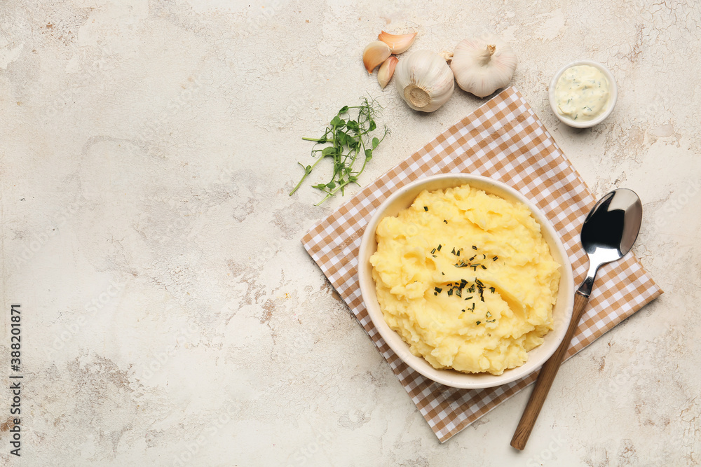 Composition with tasty mashed potato and garlic on table