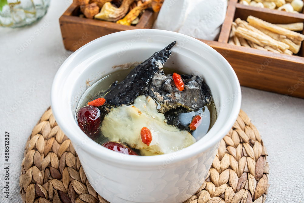 Stewed black-bone chicken with red dates and angelica in Chinese health soup