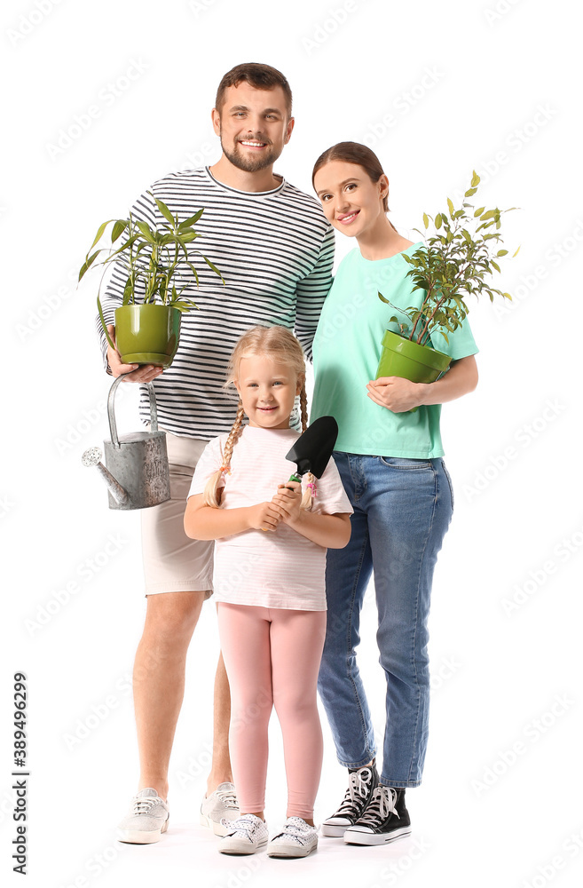 Young family with gardening supplies and houseplants on white background
