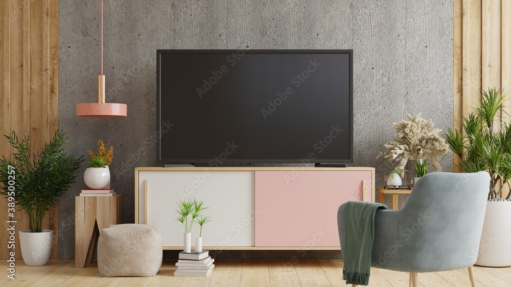 Smart TV on the concrete wall in living room with armchair,minimal design.