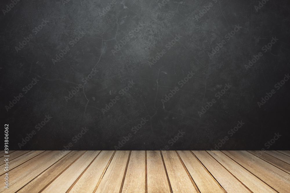 Empty room interior with wooden planks floor and black concrete wall, mockup, spot light