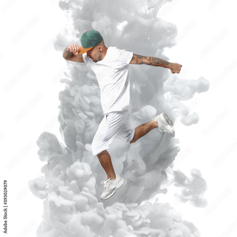 Male hip-hop dancer with splash of paint on white background