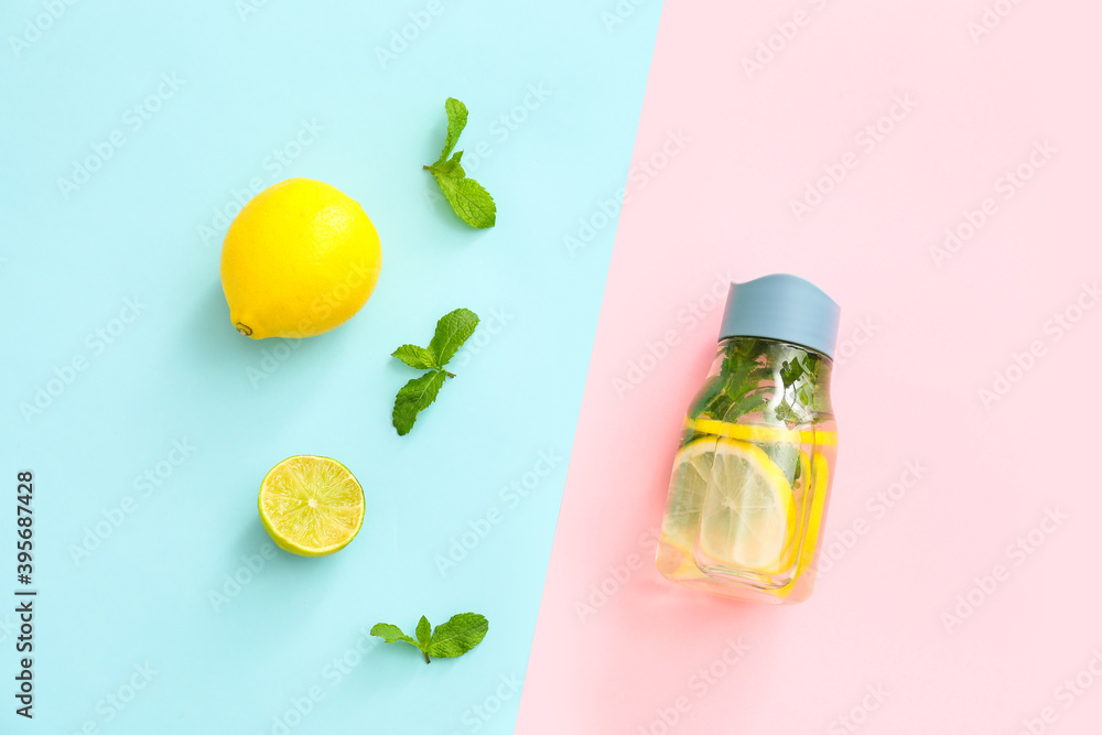 Bottle of clean water with lemon and mint on color background