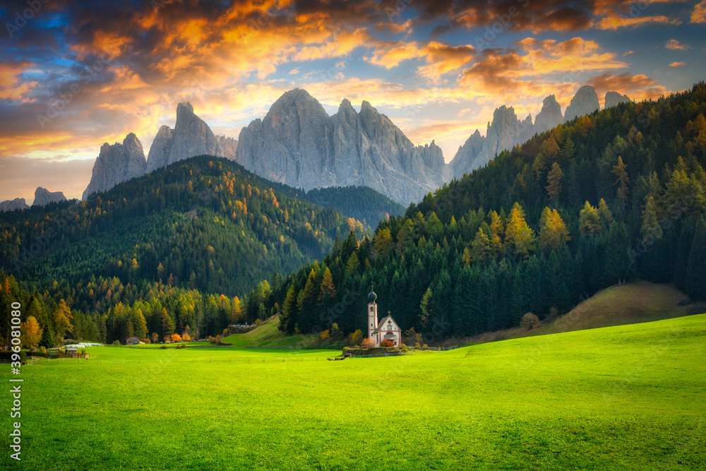 Scenery of Dolomites with the St. Johns in Ranui Chapel, Santa Maddalena at sunset. Italy