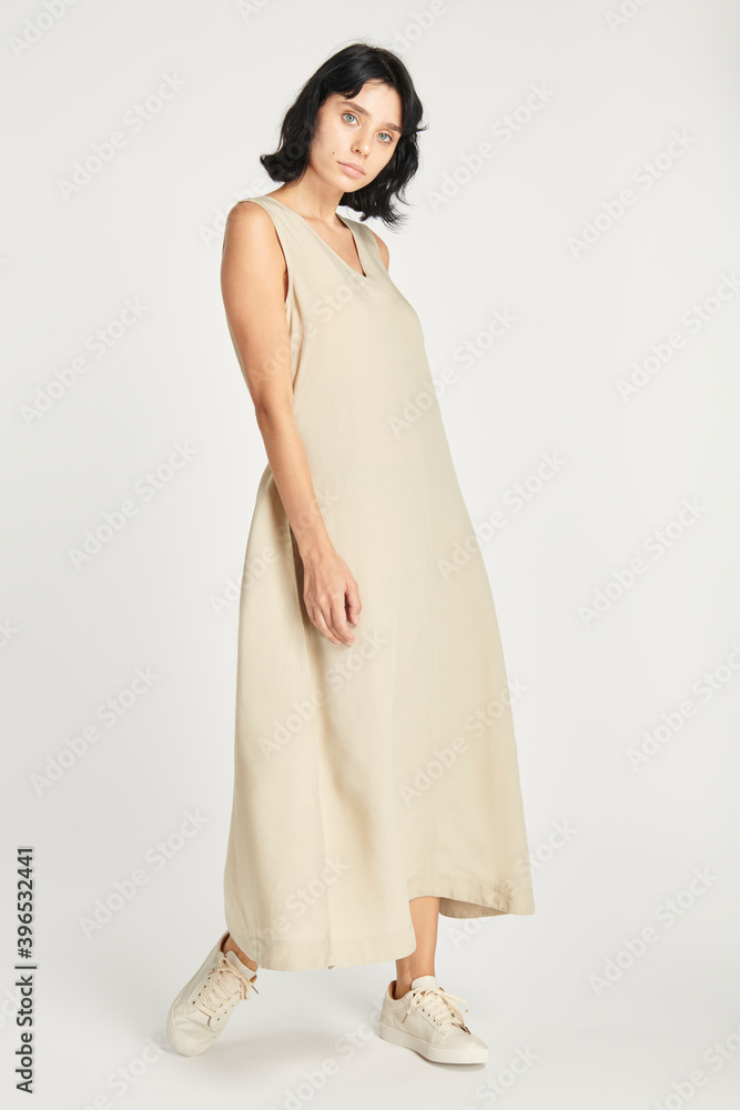 Woman in a minimal beige dress mockup