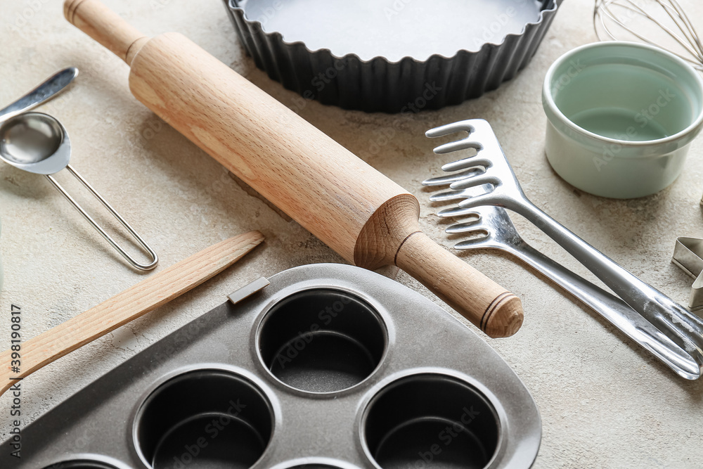 Set of kitchen utensils for bakery on grey background