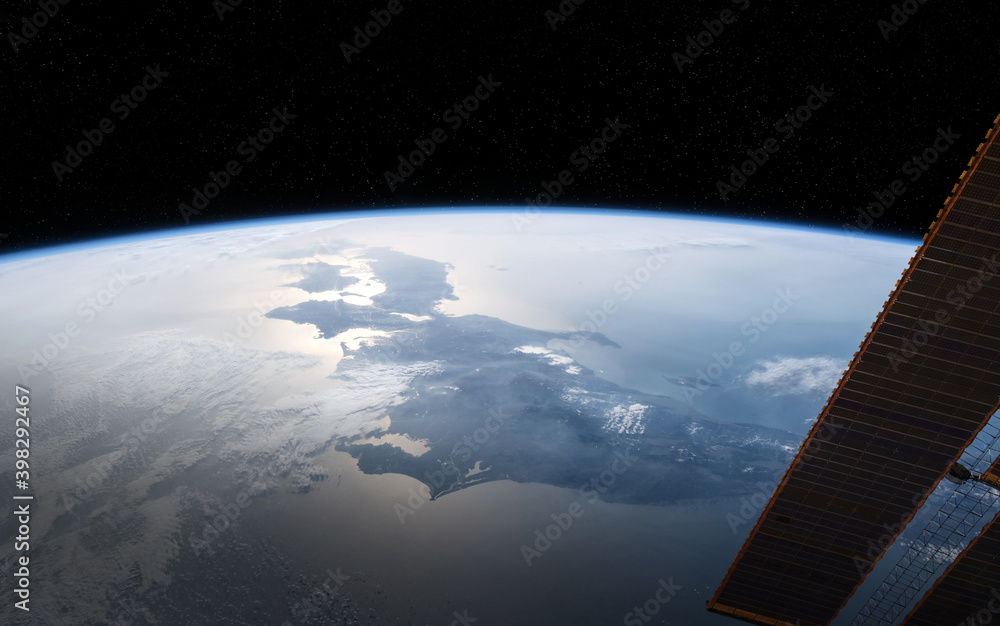 View of planet Earth from a space station window during a sunrise 3D rendering elements of this imag