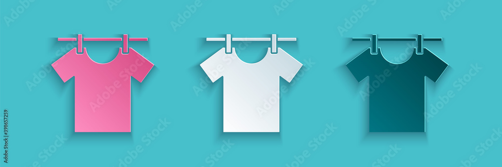 Paper cut Drying clothes icon isolated on blue background. Clean shirt. Wash clothes on a rope with 