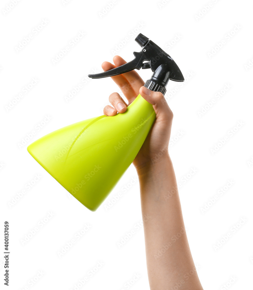 Hand with water sprayer on white background